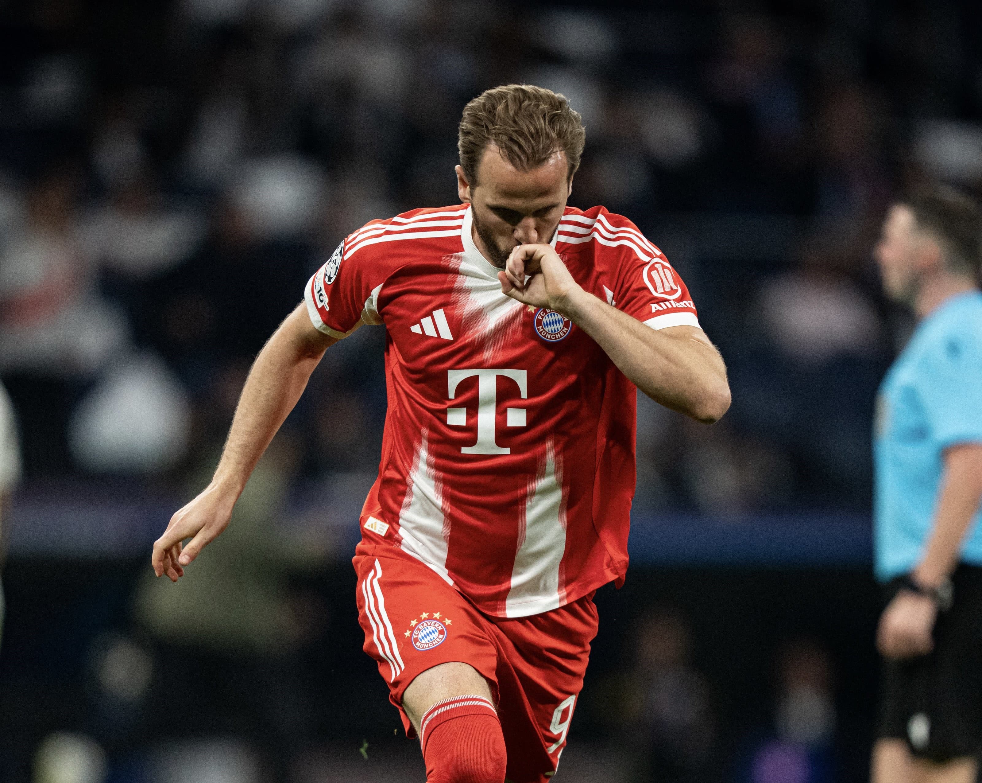 "Harry Kane celebrates his goal as Bayern Munich defeats Real Madrid 2-1 in Champions League quarter-final first leg at Santiago Bernabéu"