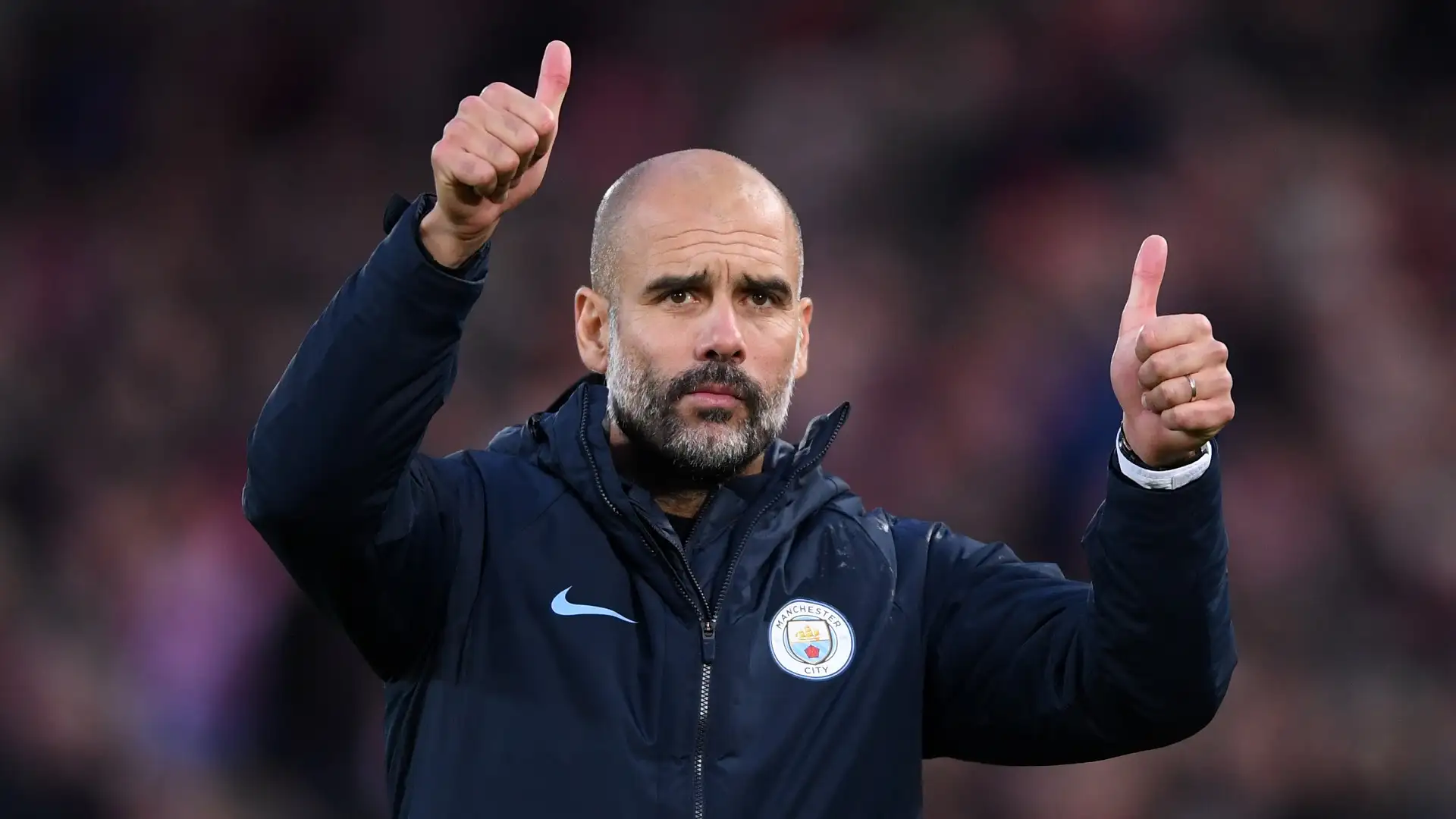 Pep Guardiola lifting trophy as Manchester City manager at the Etihad Stadium